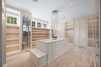 Every detail of the primary closets were designed with beauty and functionality in mind. In the first primary closet, you will find hidden storage, a large Brown jewelry safe, a beverage center, and a built-in ironing center.