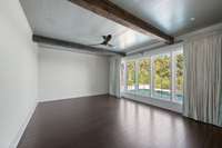 The Primary bedroom features beautiful beams and pine ceilings. This room is ready for you to make it your own personal retreat!