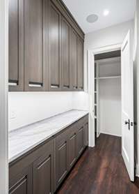 The main level features a butlers pantry with a large cleaning closet.