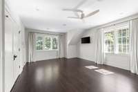 The fourth guest bedroom has an unbeatable skyline view, walk-in closet, built-in nook for guest hospitality, and an en-suite bathroom.