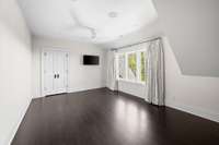 The second guest bedroom features a stellar skyline view, an oversized walk-in closet fitted with California Closets, and an en-suite bathroom.