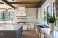 All of the cabinetry is carefully crafted from ceramic steel, antiqued brass, and walnut. *This photograph is copyrighted and exclusively licensed to Alyssa Rosenheck Photography. Use or reproduction without permission is strictly prohibited.