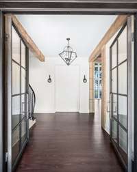 Your grand entrance is outfitted with custom Iron Lion doors.