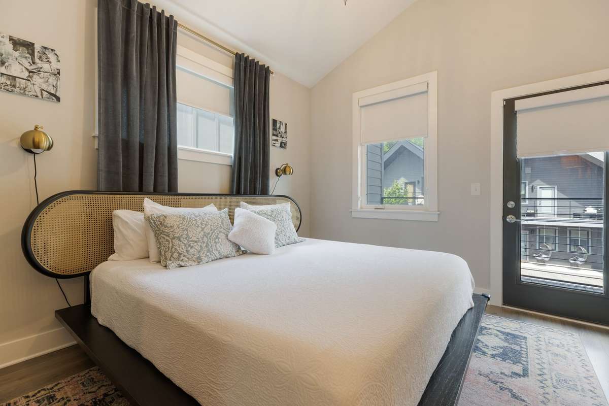 The door pictured in this photo leads out to the upstairs patio. Such a nice space to enjoy private outdoor time.