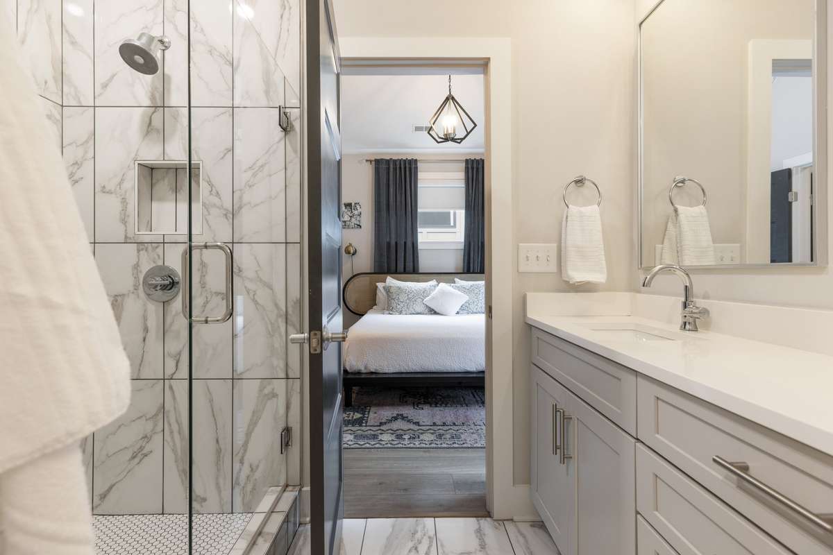 Gorgeous tile and lots of counter space and two sinks make this bathroom easy to share or not...