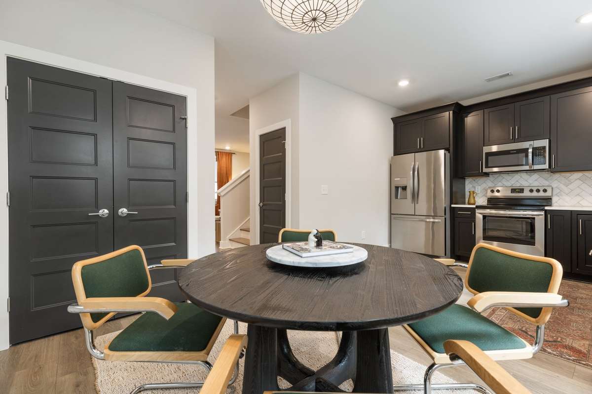 Updated lighting over the kitchen table adds a nice fresh vibe to the home.