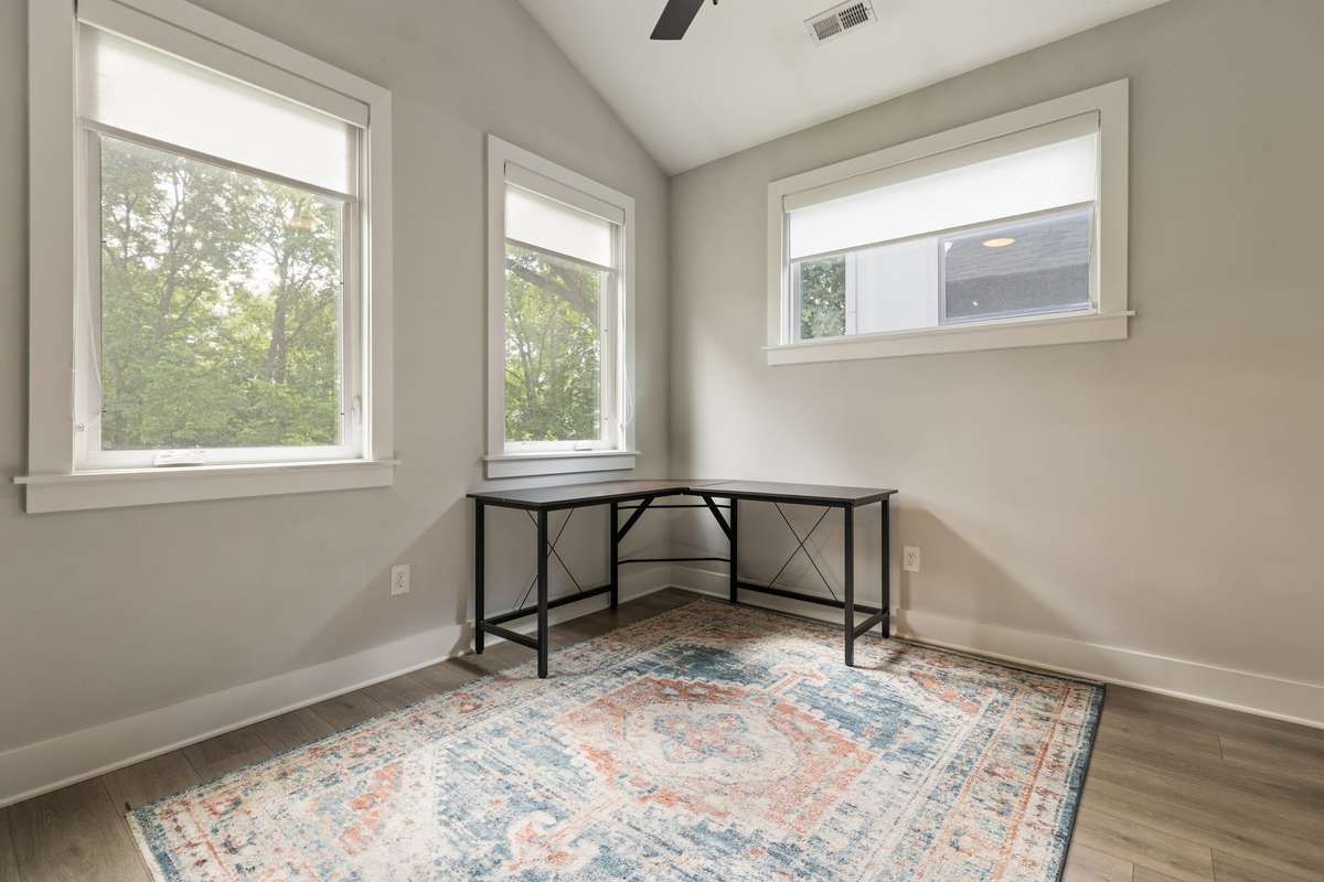 The second bedroom is located in the rear of the home and is also spacious, offering many of the features of the primary bedroom.