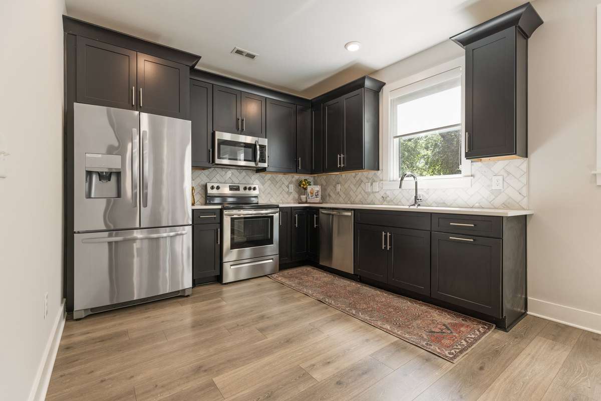 The kitchen offers SS appliances, an eat in area and pantry. The window over the sink is a nice touch to bring in natural sunlight to the space.