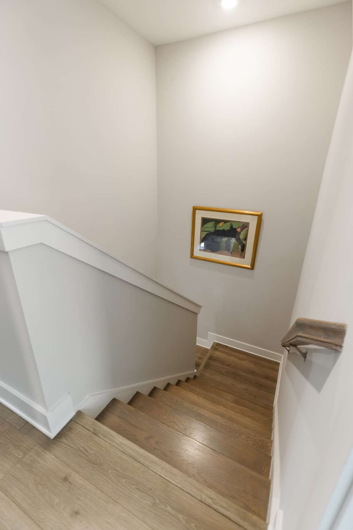 The wooden treads on the stairs and LVP flooring keep this home clean and fresh. NO CARPET in this house!