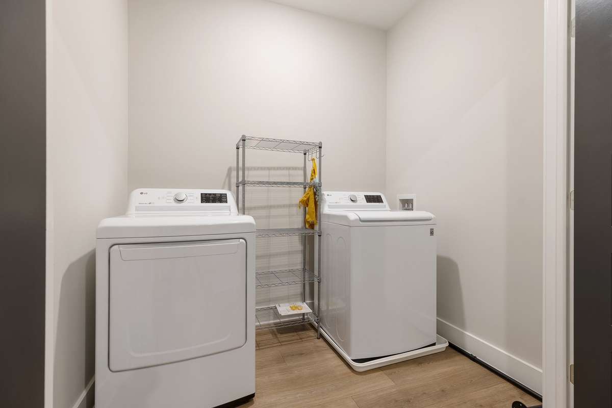 The laundry area is located right at the top of the stairs, making it very easy to put away clean clothes/linen/towels.