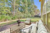 Huge patio overlooking backyard. . Virtually Staged