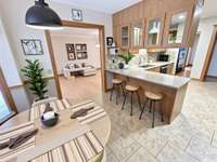 You’ll love the large dining room, breakfast nook, and kitchen bar seating—perfect for family meals and entertaining. Virtually Staged Photo for Inspiration Only and to Showcase How Space Can Be Used and Furnished.