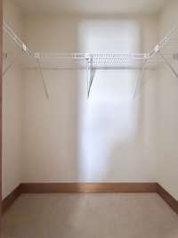 Guest bedroom has spacious walk-in closet