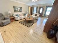 Separate living room with fireplace offers a cozy spot for quieter moments.