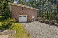 One car garage with opener and 1 remote for the basement.  Dog door in pedestrian door can be removed and door replaced if buyer prefers.