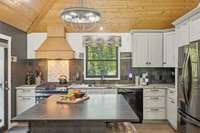 Completely remodeled kitchen with updated appliances and built in microwave drawer.  Pantry cabinet with roll out shelving.