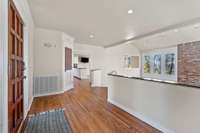 The light-filled entry foyer overlooks the lower level family room.
