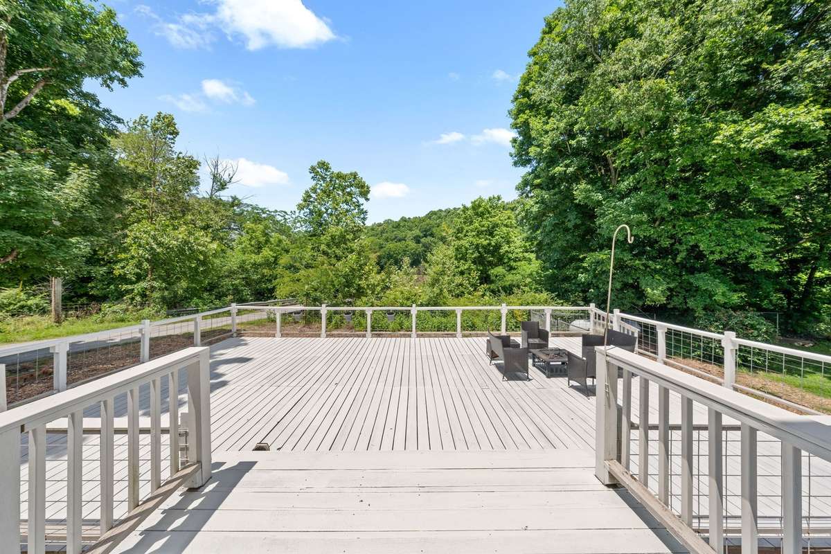 Massive back deck overlooking creek