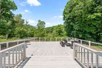 Massive back deck overlooking creek