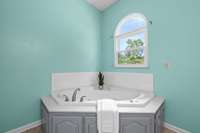 Primary bathroom with corner soaking tub