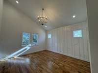 Vaulted ceiling in the Primary Bedroom with an accent wall.