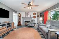 Stairs to the bonus room are off to the right of this picture, Fireplace and ceiling fans have also all been updated, along with the flooring