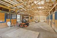 Horse stable offers natural over head lighting and multiple stalls.  564 Hodges Road Smithville, TN 37166