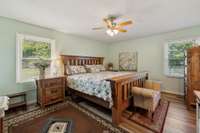 Large primary bedroom with two windows and ceiling fan.  564 Hodges Road Smithville, TN 37166