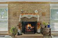 Brick mantel with cozy fireplace.  564 Hodges Road Smithville, TN 37166