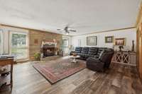 Spacious living room with two large symmetrical windows and wood style flooring.   564 Hodges Road Smithville, TN 37166
