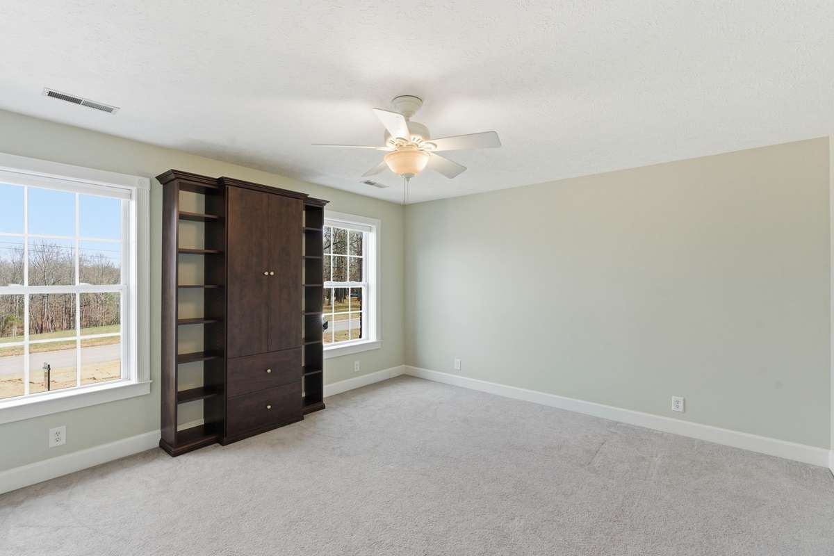 Bedroom #3 with built-in cabinetry, walk-in closet and beautiful views!