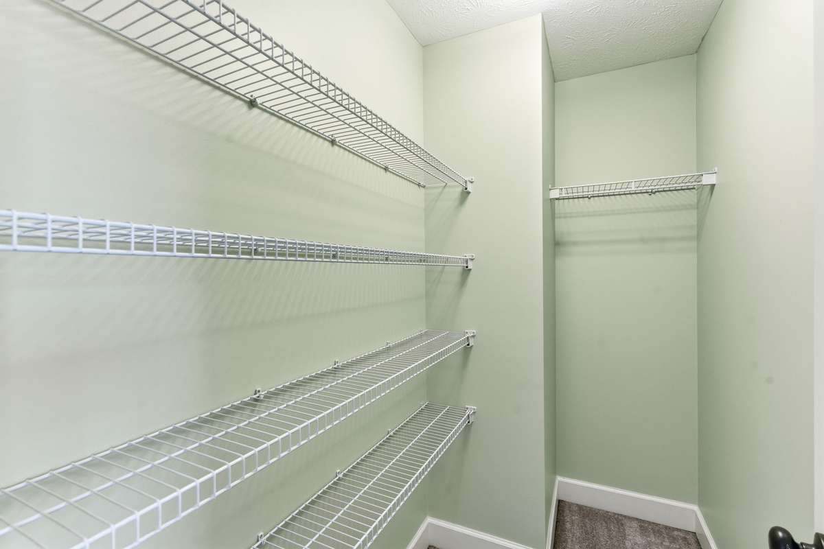 Bedroom #3 with built-in cabinetry, walk-in closet and beautiful views!