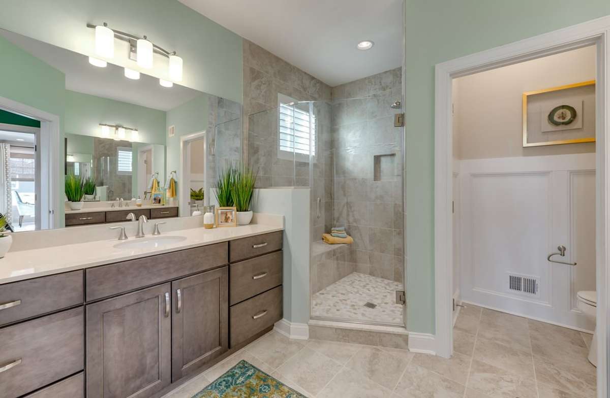 Owners bath: Images highlight the potential of this floorplan, shown here from a completed model home. Final design and finishes of your to-be-built home will be determined by your personal selections