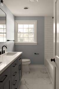 Bathroom with a double vanity and soaking tub for added comfort.