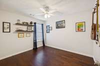 2nd Bedroom with hardwood flooring and full closet.