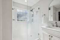 Sophisticated master bath with tiled shower, new plumbing and fixtures.