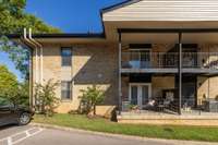 Ground level end unit with a covered porch just steps away from parking.