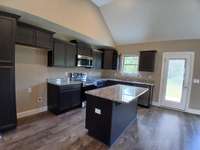 Kitchen has Custom Stacked Cabinets and Cabinet Pantry.  
Picture of Previous House.