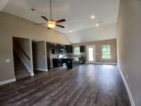 Beautiful and Durable Plank Flooring in Living Room, Kitchen & Dining Area. 
Photo of Previous House.