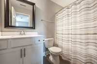 Full second bathroom with a tub/shower combo.