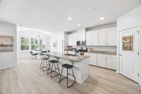 The heart of the home. This bright, white kitchen flows seamlessly into the sunny breakfast room and spacious great room, making entertaining a breeze.