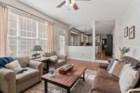 The den opens to the paver patio, providing convenient outdoor access for entertaining, dining, or simply enjoying the backyard