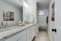 Huge upstairs bath with double sinks & Linen closet. There is another Closet in the hall.