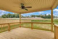 Covered back deck with large fan—perfect for relaxing, entertaining, or enjoying the outdoors year-round.