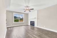 Cozy gas fireplace with shiplap surround and modern mantle—creates a stylish focal point in the living room.