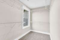 Spacious primary bedroom featuring a luxurious en-suite with dual vanities and a large walk-in closet—offering both comfort and functionality.