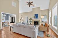 Open layout living space with vaulted ceiling