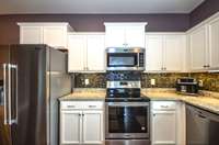 Granite countertops, upgraded appliances, and under-cabinet lighting