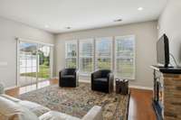Plantation shutters and view of the large open space out back.