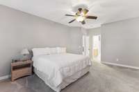 Primary bedroom suite on the main floor. The bedroom overlooks the front of the yard, the primary bathroom goes towards the back of the house. This is a nice long bedroom/bathroom suite!